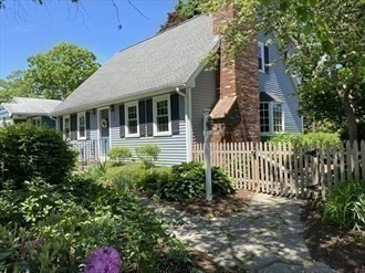 17 Jane Street Randolph, MA 02368 - Photo 2 of 18 a front view of a house with a garden