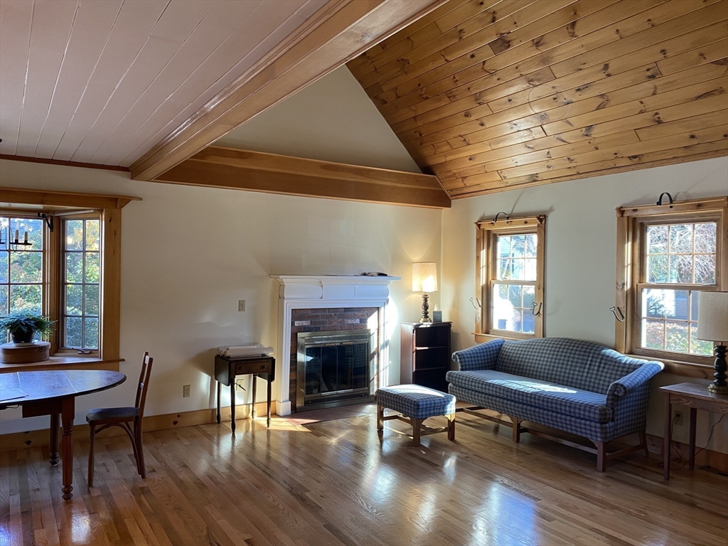 17 Jane Street Randolph, MA 02368 - Photo 4 of 18 a living room with furniture a fireplace and wooden floor