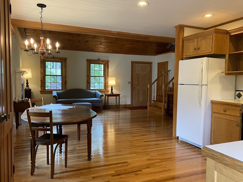 17 Jane Street Randolph, MA 02368 - Photo 5 of 18 a view of a dining room with furniture and wooden floor