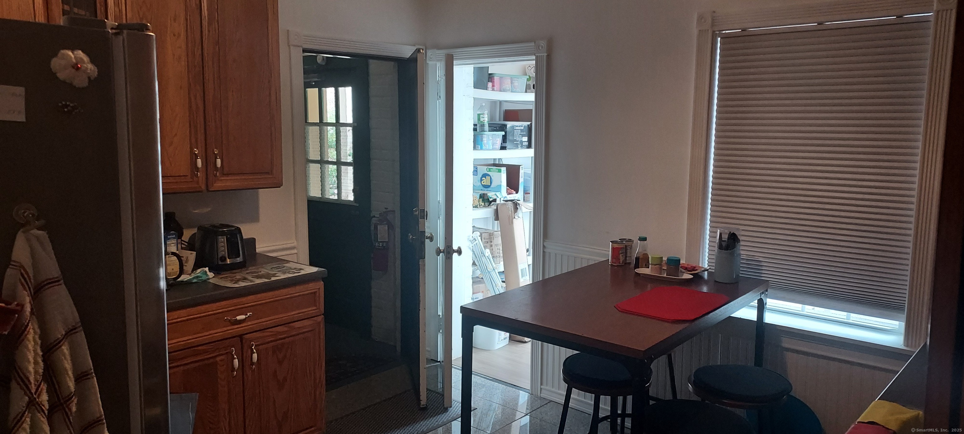 580 Wilmot Avenue, Unit 2 Bridgeport, CT 06607 - Photo 3 of 10 a view of a kitchen area with furniture and window