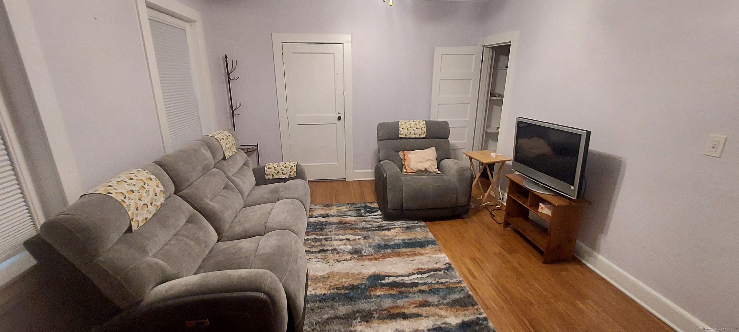 580 Wilmot Avenue, Unit 2 Bridgeport, CT 06607 - Photo 8 of 10 a living room with furniture and a flat screen tv