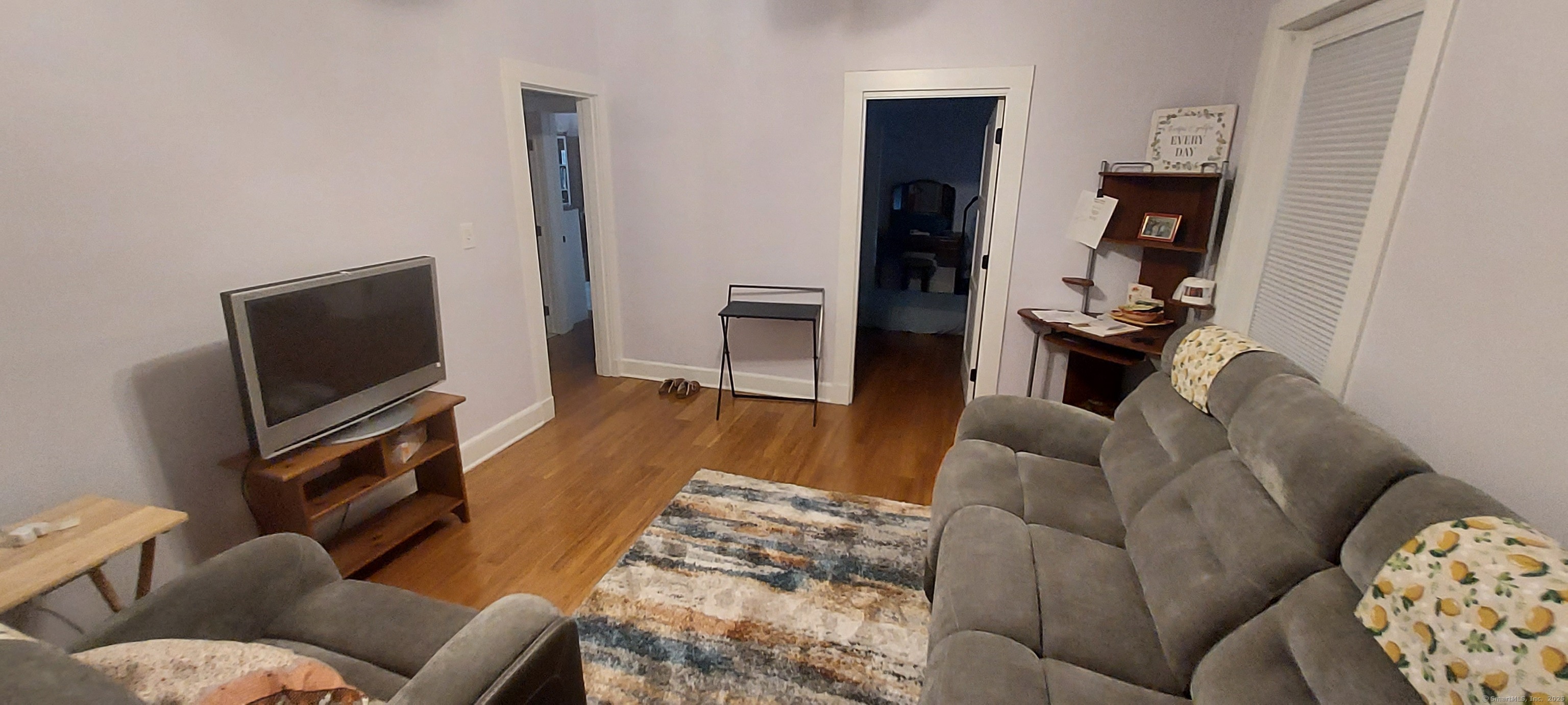 580 Wilmot Avenue, Unit 2 Bridgeport, CT 06607 - Photo 9 of 10 a living room with furniture and a flat screen tv