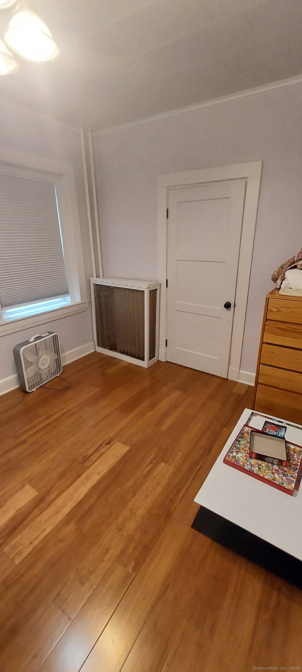 580 Wilmot Avenue, Unit 2 Bridgeport, CT 06607 - Photo 10 of 10 a bedroom with a bed and a window