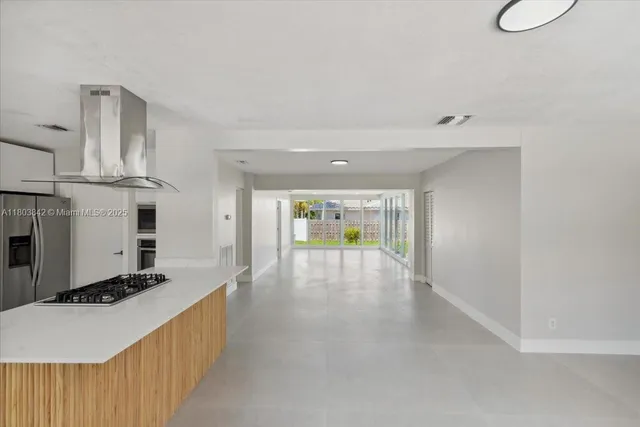 a view of a kitchen with furniture and a fireplace