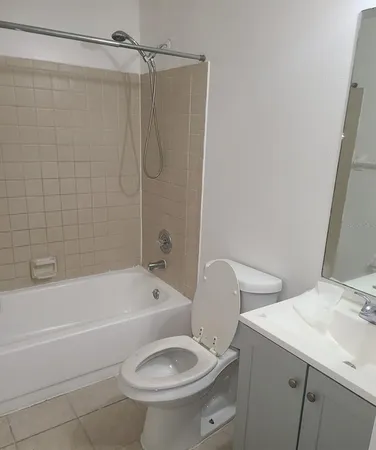a bathroom with a sink a toilet and a bathtub