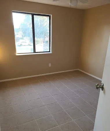 a view of an empty room with a window