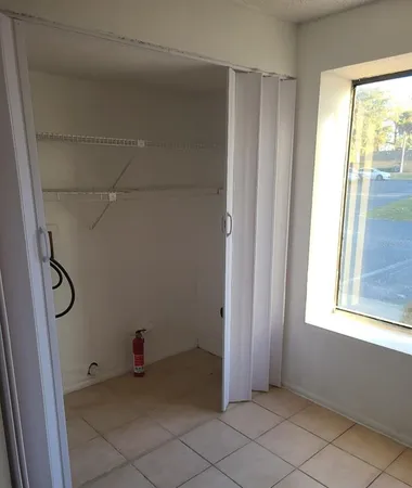 a view of an empty room with a window