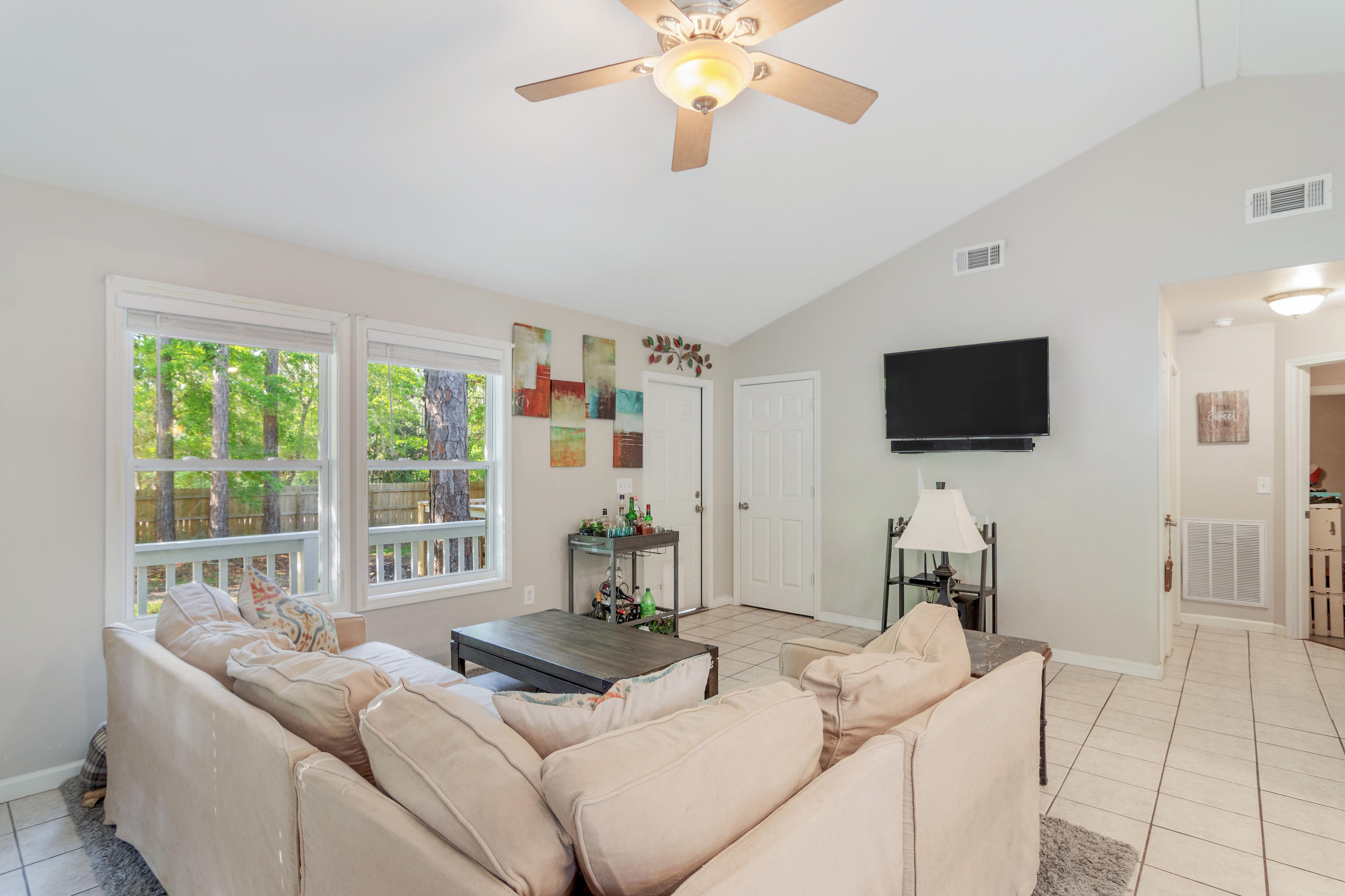 1273 Indian Woman Road Santa Rosa Beach, FL 32459 - Photo 4 of 4 a living room with furniture and a flat screen tv