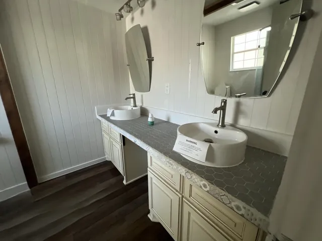 a bathroom with a sink and a mirror
