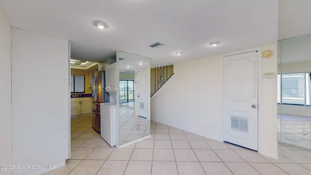 a view of an empty room and a window