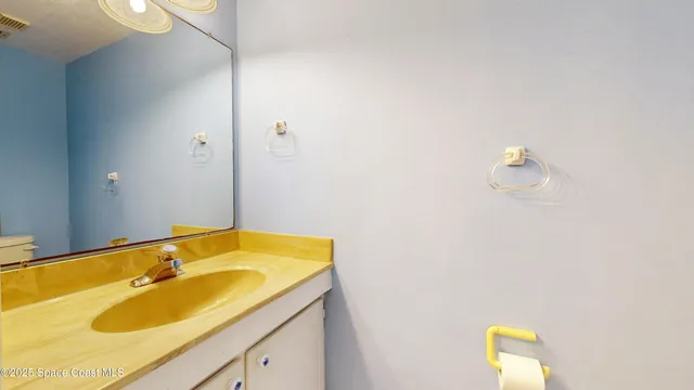 a view of a hallway with paintings on the wall