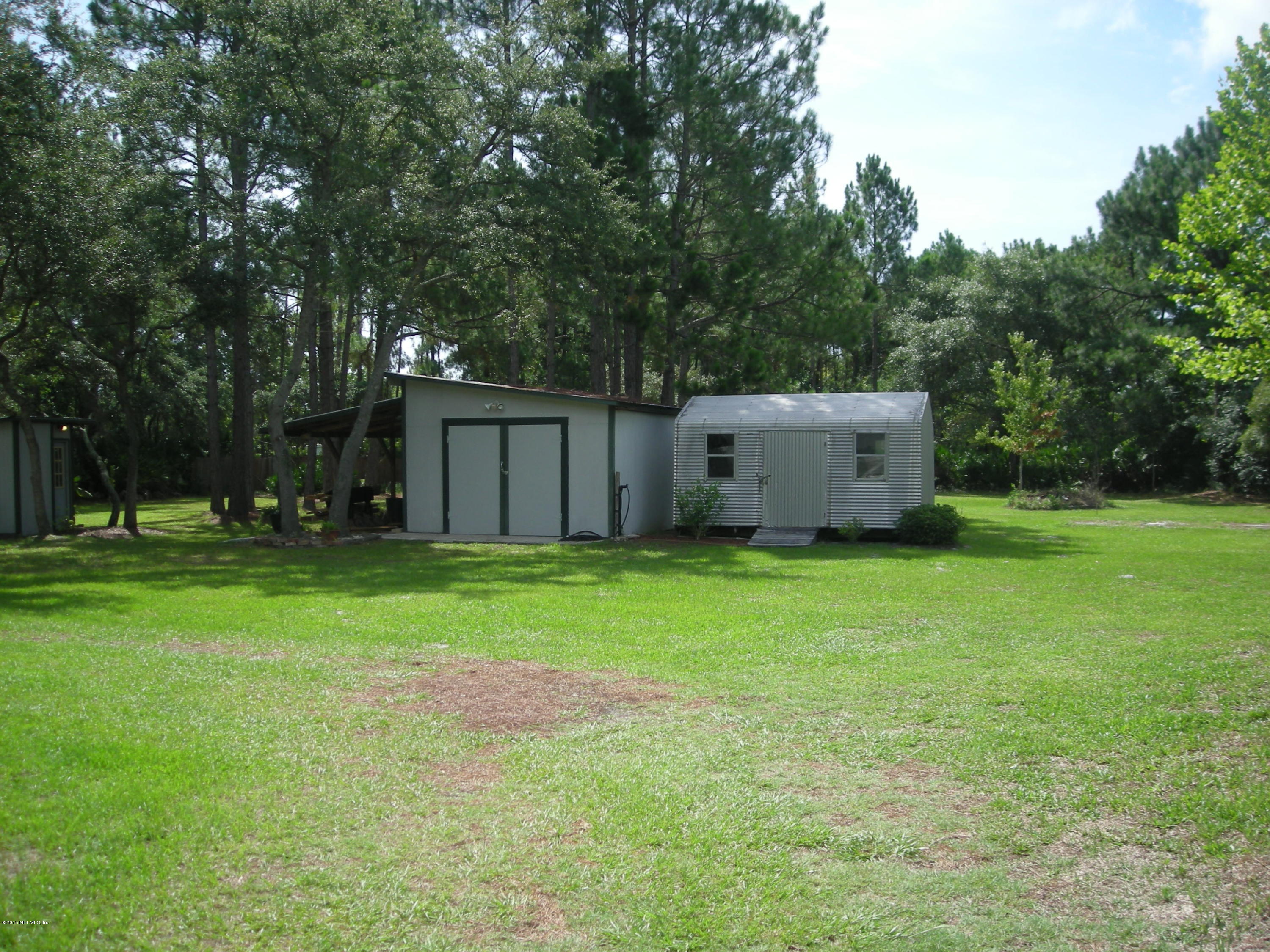 215 Stokes Landing Road St. Augustine, FL 32095 - Photo 5 of 19 a view of a backyard with large trees