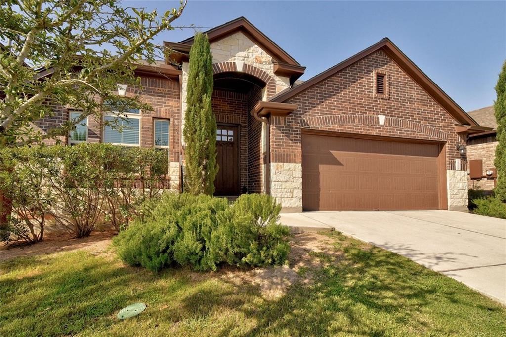 18509 Tanner Bayou Loop Austin, TX 78738 - Photo 1 of 1 a front view of a house with a yard