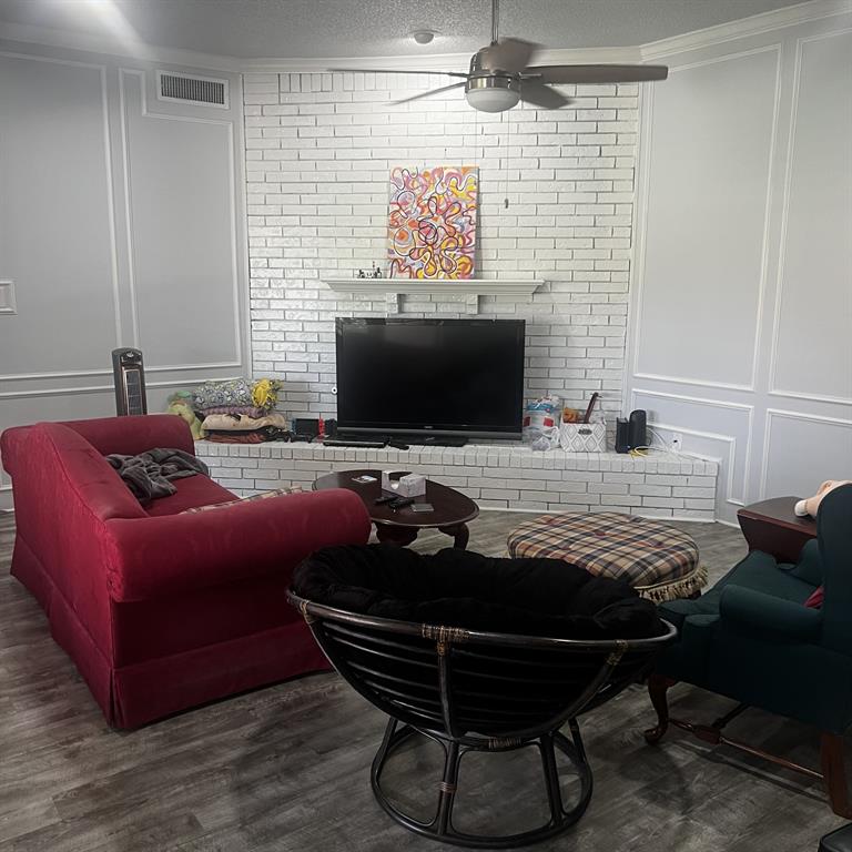 2029 Springwood Place, Unit A Carrollton, TX 75006 - Photo 2 of 9 a room with furniture and a flat screen tv