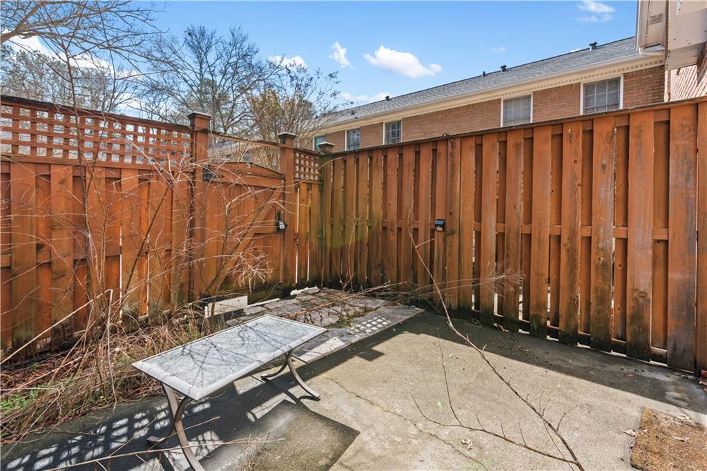 1101 Collier Road Northwest, Unit D5 Atlanta, GA 30318 - Photo 23 of 38 a view of a backyard with wooden fence