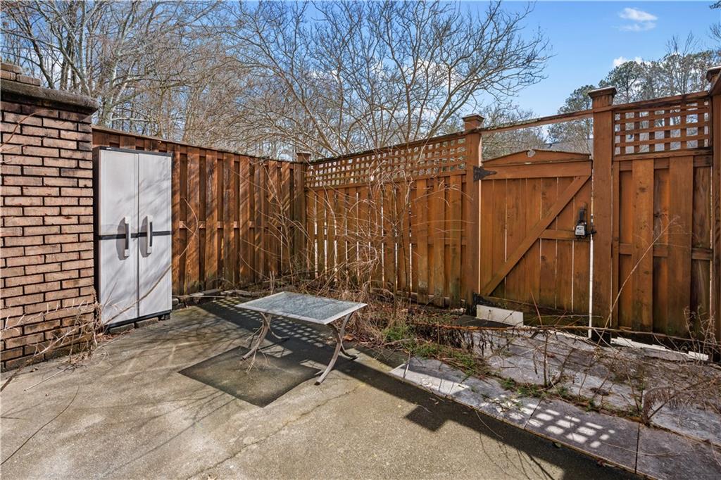 1101 Collier Road Northwest, Unit D5 Atlanta, GA 30318 - Photo 24 of 38 a view of a backyard with chairs