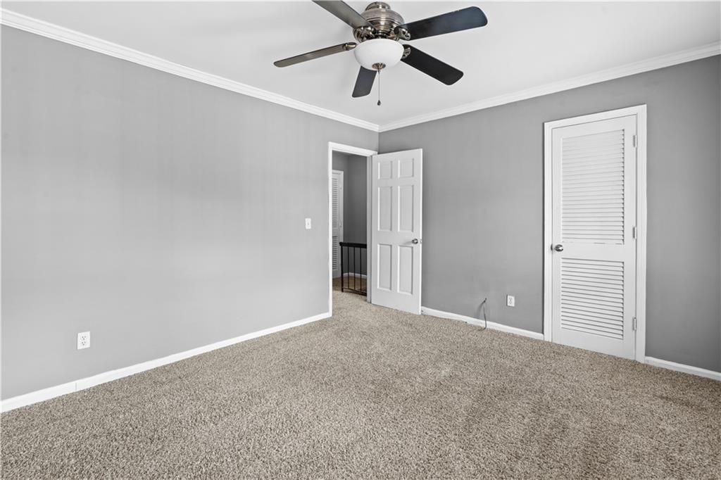 1101 Collier Road Northwest, Unit D5 Atlanta, GA 30318 - Photo 25 of 38 a view of an empty room and chandelier fan