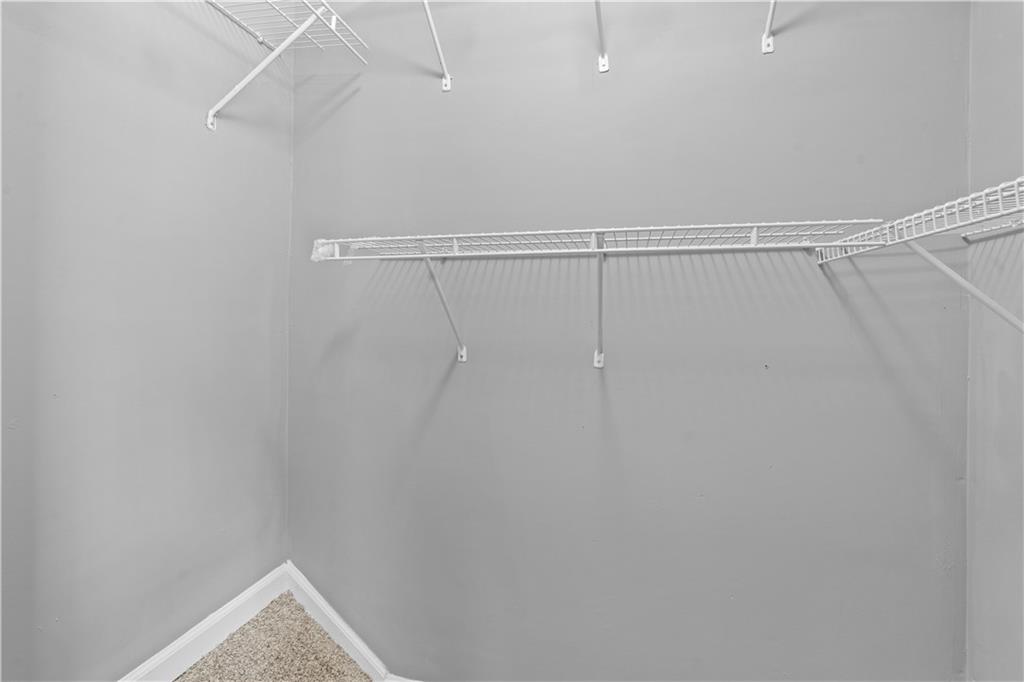 1101 Collier Road Northwest, Unit D5 Atlanta, GA 30318 - Photo 35 of 38 a view of a room with racks on the wall