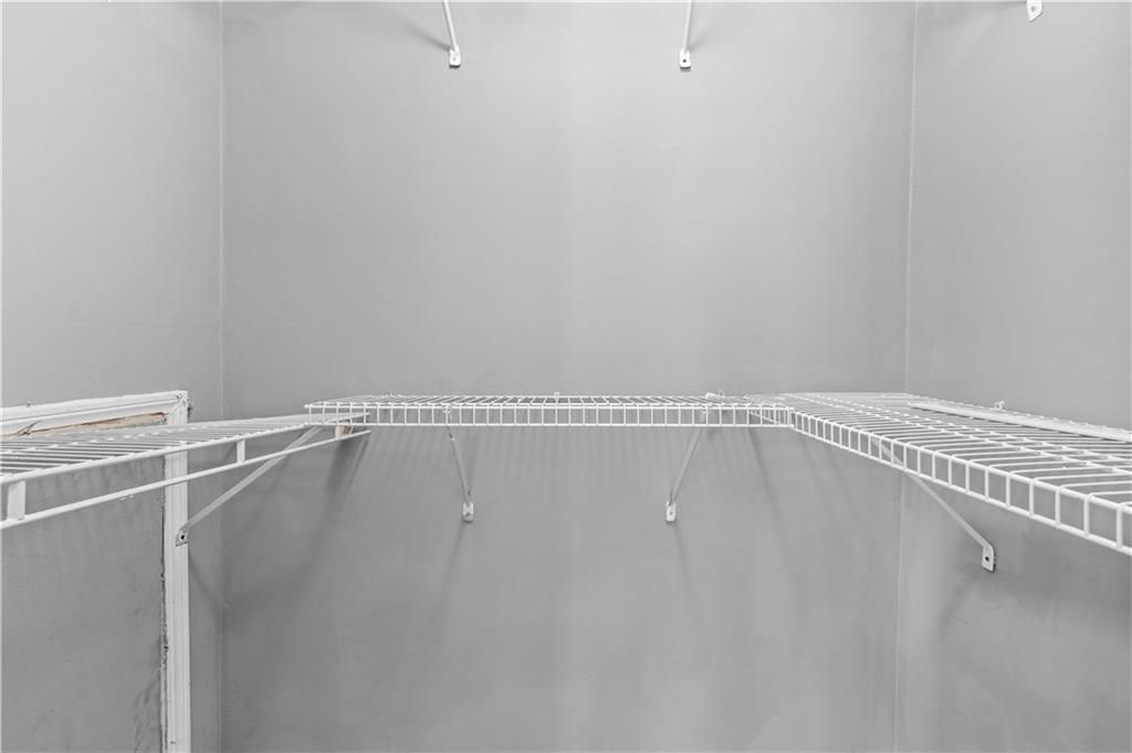 1101 Collier Road Northwest, Unit D5 Atlanta, GA 30318 - Photo 36 of 38 a view of a room with racks on the wall