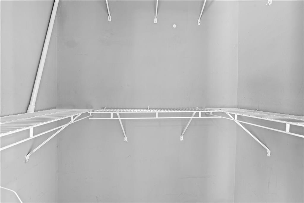 1101 Collier Road Northwest, Unit D5 Atlanta, GA 30318 - Photo 38 of 38 a view of a room with racks on the wall