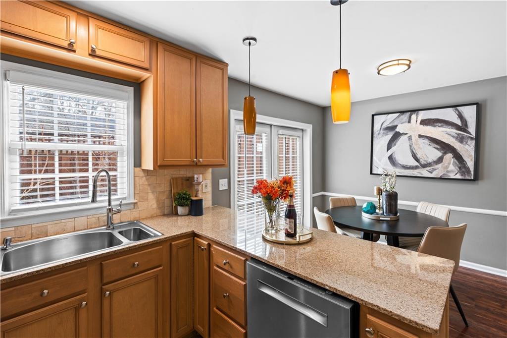 1101 Collier Road Northwest, Unit D5 Atlanta, GA 30318 - Photo 5 of 38 a kitchen with a sink cabinets and window