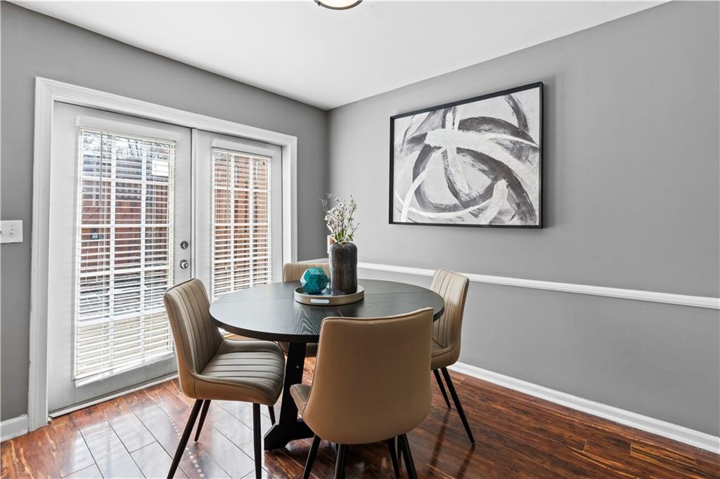 1101 Collier Road Northwest, Unit D5 Atlanta, GA 30318 - Photo 9 of 38 a dining room with furniture and window
