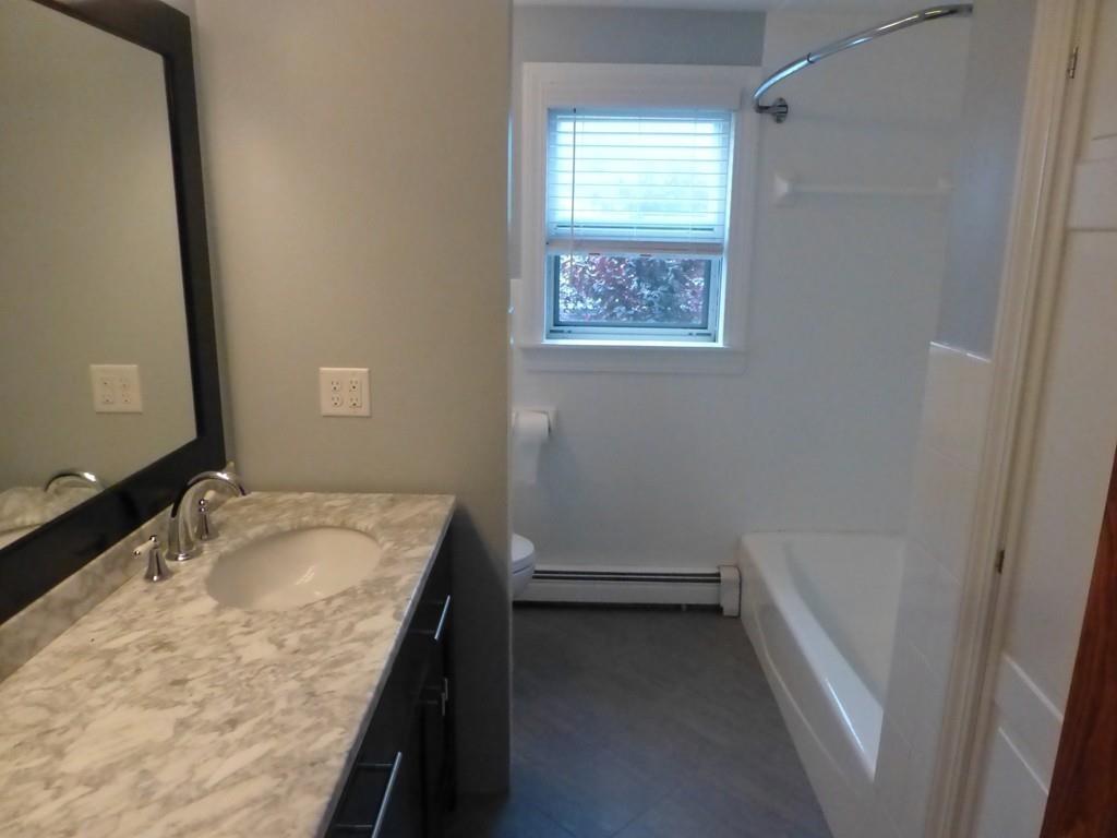 38 Whitcomb Road Scituate, MA 02066 - Photo 20 of 22 a bathroom with a granite countertop sink and a vanity