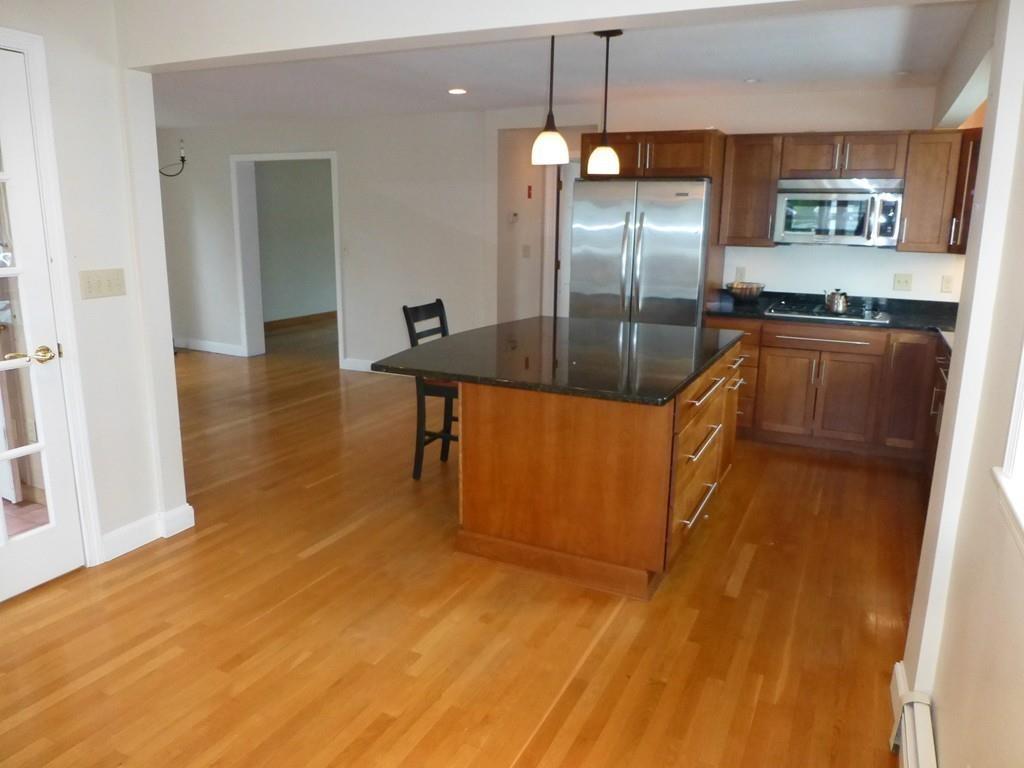 38 Whitcomb Road Scituate, MA 02066 - Photo 8 of 22 a kitchen with stainless steel appliances granite countertop a sink a stove and a refrigerator