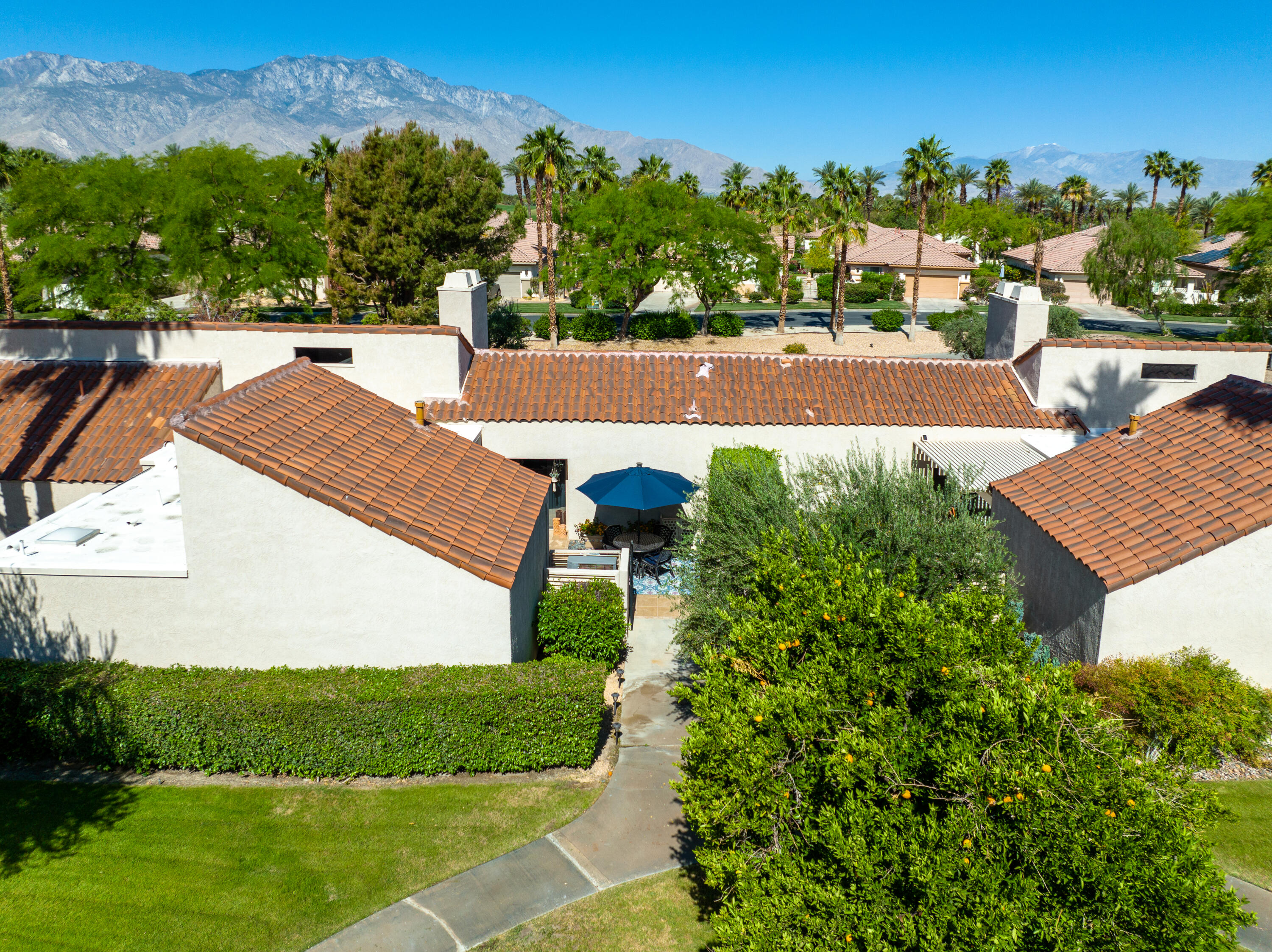 303 Forest Hills Drive Rancho Mirage, CA 92270 - Photo 2 of 72 a view of a yard and front view of a house