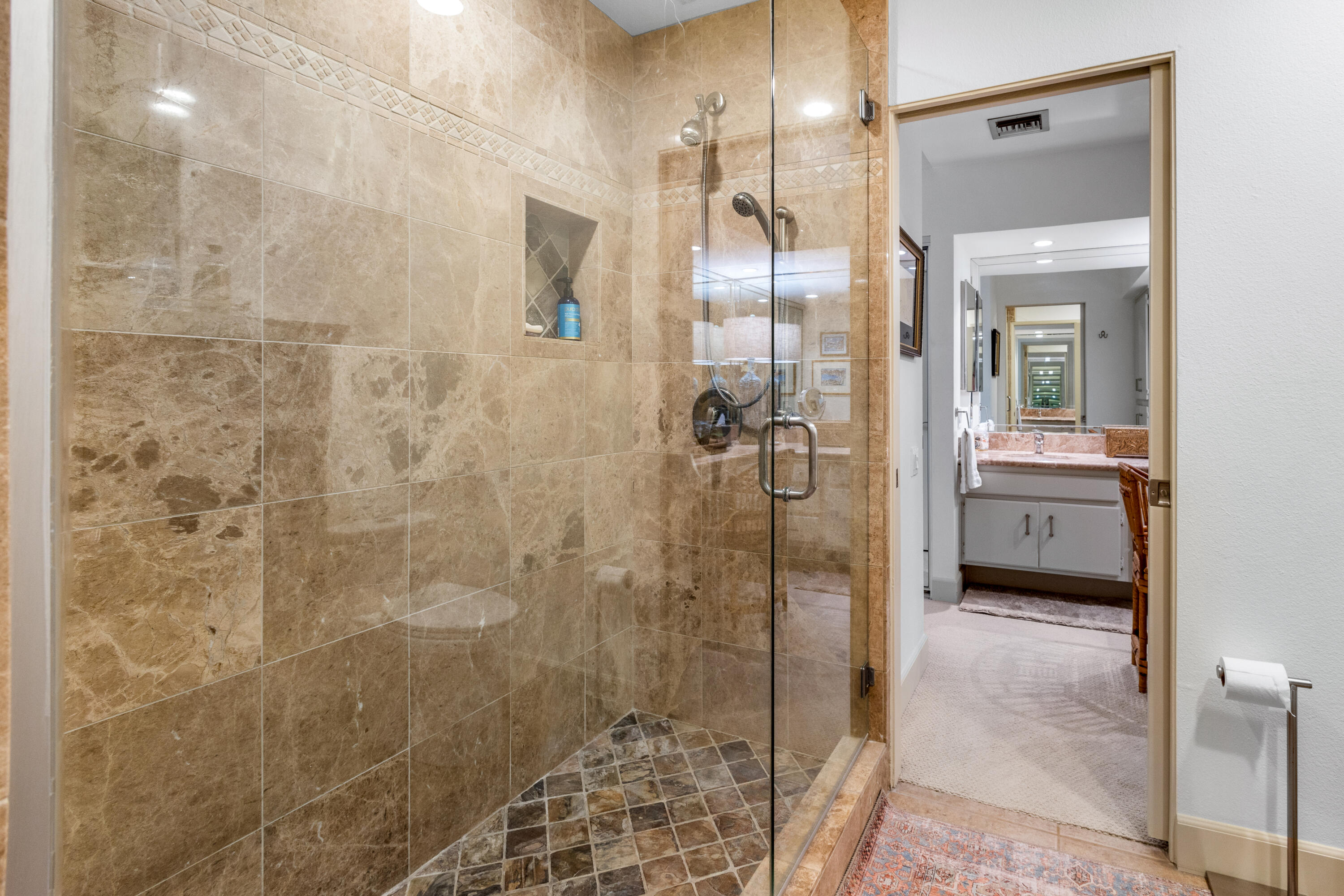 303 Forest Hills Drive Rancho Mirage, CA 92270 - Photo 40 of 72 a bathroom with a glass shower door and a sink