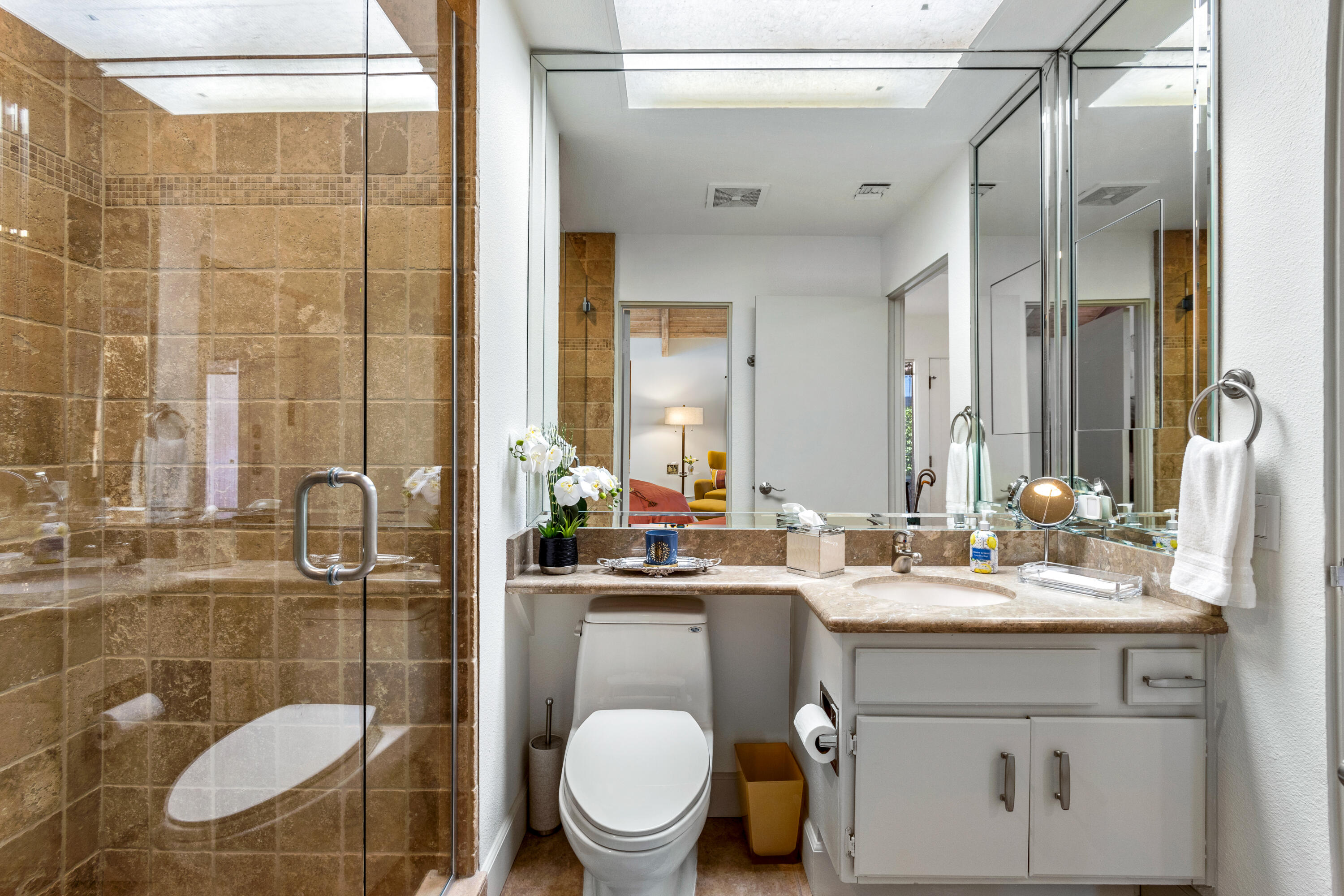 303 Forest Hills Drive Rancho Mirage, CA 92270 - Photo 50 of 72 a bathroom with a sink a toilet and shower