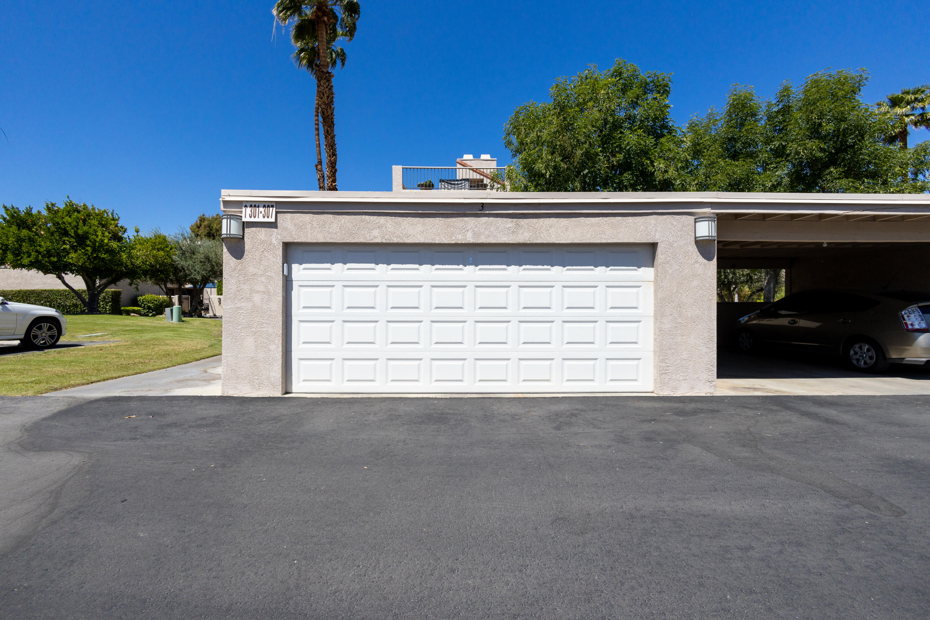 303 Forest Hills Drive Rancho Mirage, CA 92270 - Photo 53 of 72 a view of a house with a garage