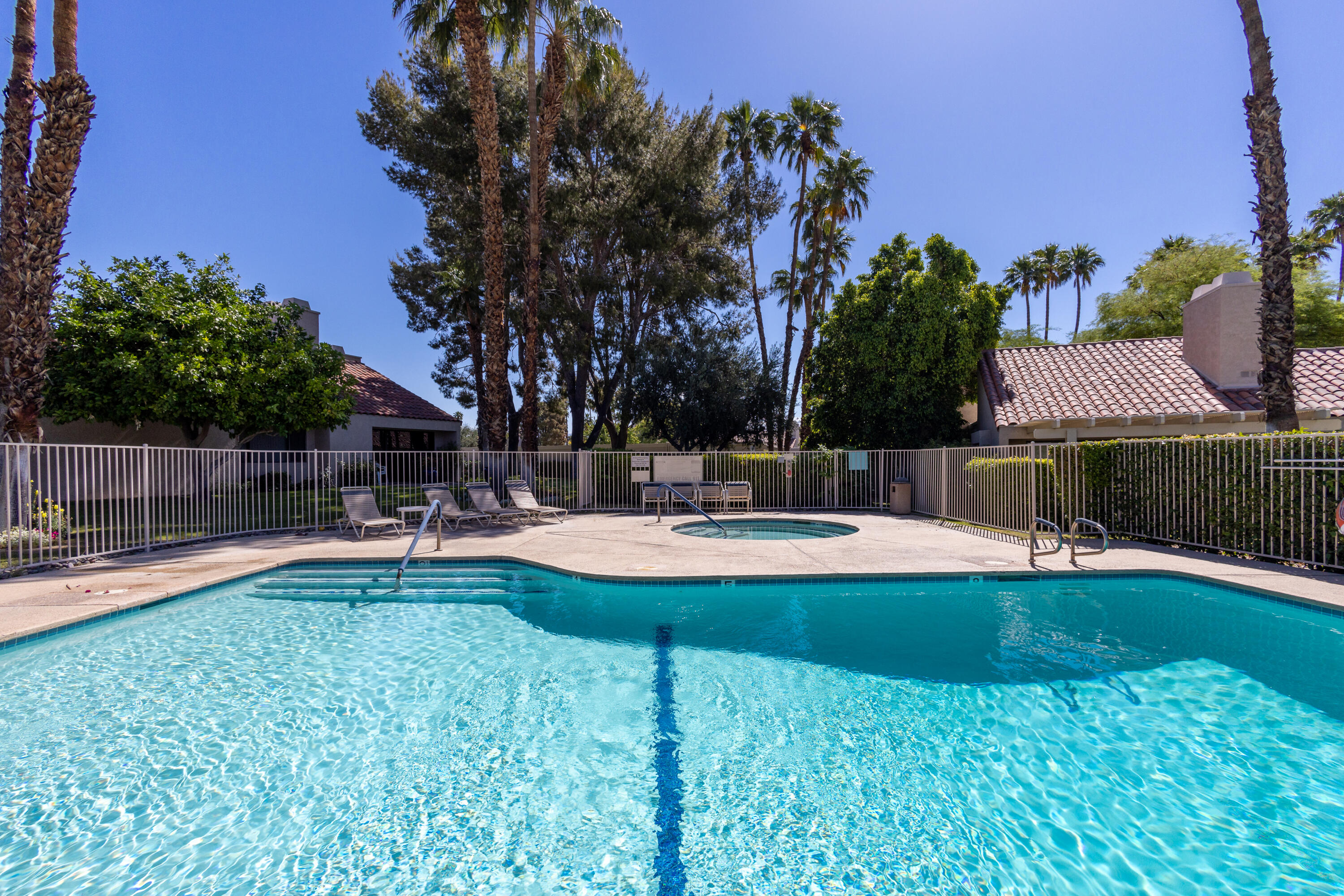 303 Forest Hills Drive Rancho Mirage, CA 92270 - Photo 65 of 72 a view of a house with swimming pool and sitting area
