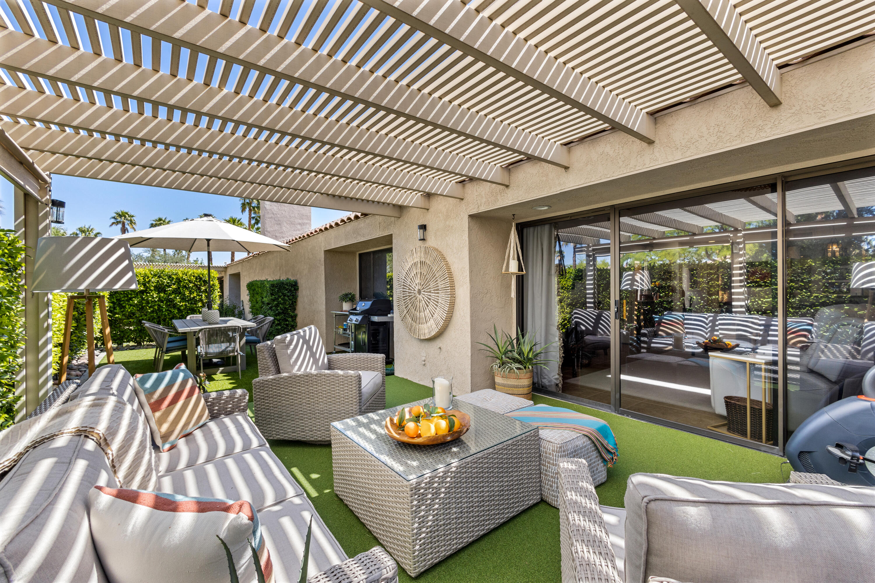 303 Forest Hills Drive Rancho Mirage, CA 92270 - Photo 10 of 72 a outdoor living space with furniture and garden view