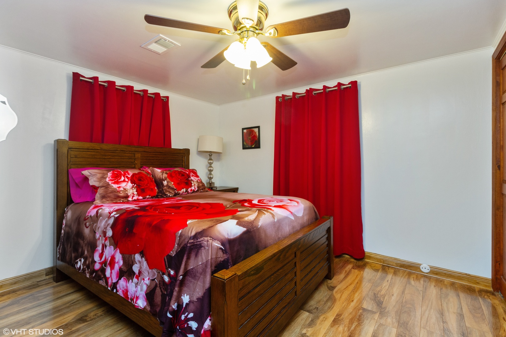 25927 Princess Lane Crete, IL 60417 - Photo 5 of 12 a bedroom with a bed and a chandelier