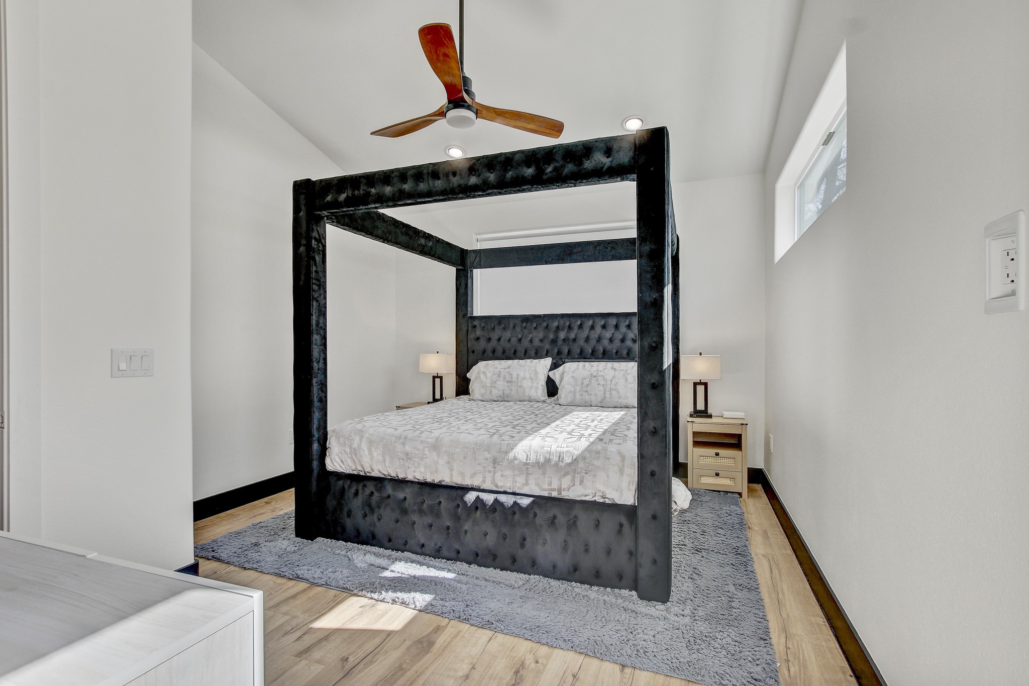 4703 Louis Avenue, Unit A Austin, TX 78721 - Photo 19 of 35 Bedroom with a ceiling fan, light wood-style floors, and recessed lighting