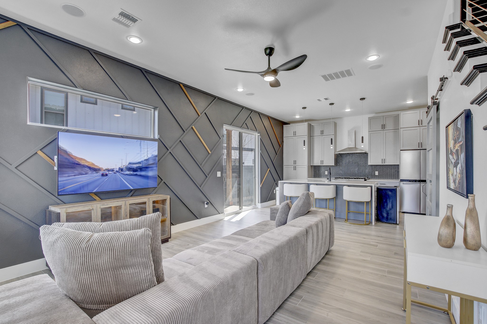 4703 Louis Avenue, Unit A Austin, TX 78721 - Photo 5 of 35 Living area featuring a ceiling fan, light wood-style flooring, a decorative wall, and recessed lighting