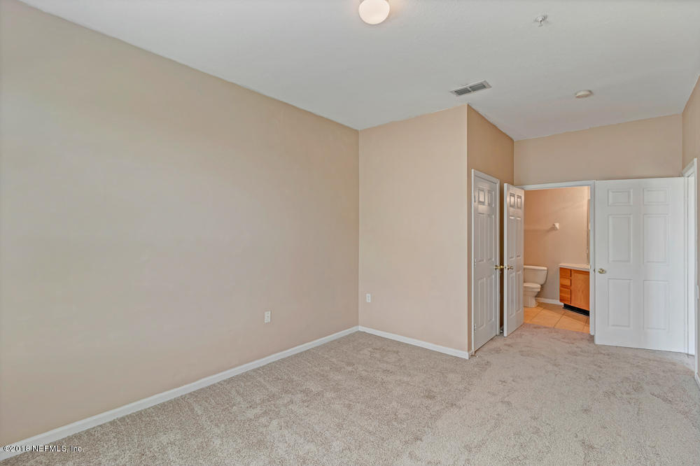7990 Baymeadows Road East, Unit 211 Jacksonville, FL 32256 - Photo 12 of 21 a view of a livingroom and a hallway