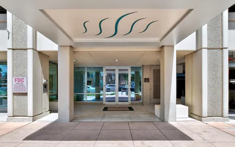 a view of a building with door space and porch