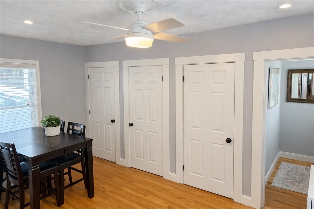 58 Bennett Street, Unit 1 Wakefield, MA 01880 - Photo 4 of 17 a view of dining room with wooden floor table and chairs