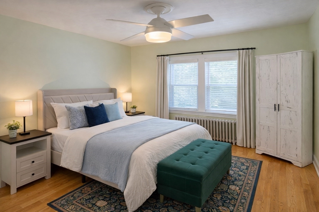 58 Bennett Street, Unit 1 Wakefield, MA 01880 - Photo 5 of 17 a bedroom with a bed and a window