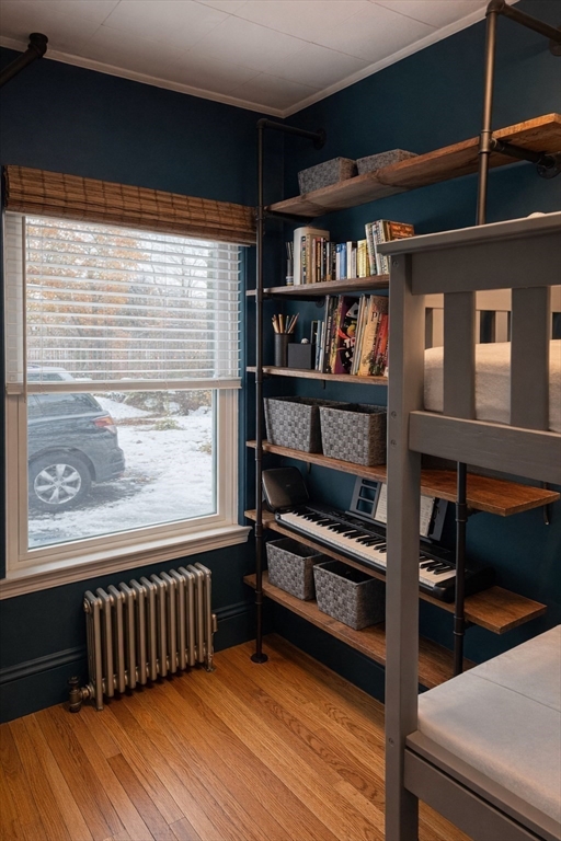 58 Bennett Street, Unit 1 Wakefield, MA 01880 - Photo 6 of 17 a view of a room with racks on the wall
