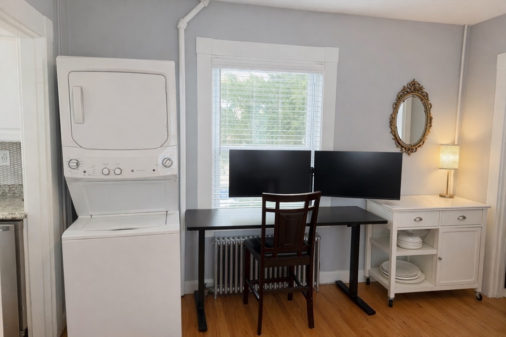 58 Bennett Street, Unit 1 Wakefield, MA 01880 - Photo 9 of 17 a living room with furniture and a window