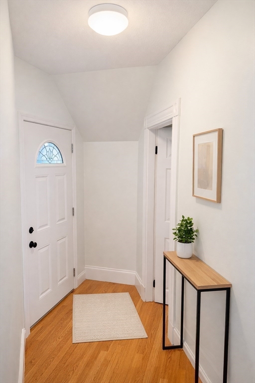 58 Bennett Street, Unit 1 Wakefield, MA 01880 - Photo 10 of 17 a bedroom with a bed and a potted plant