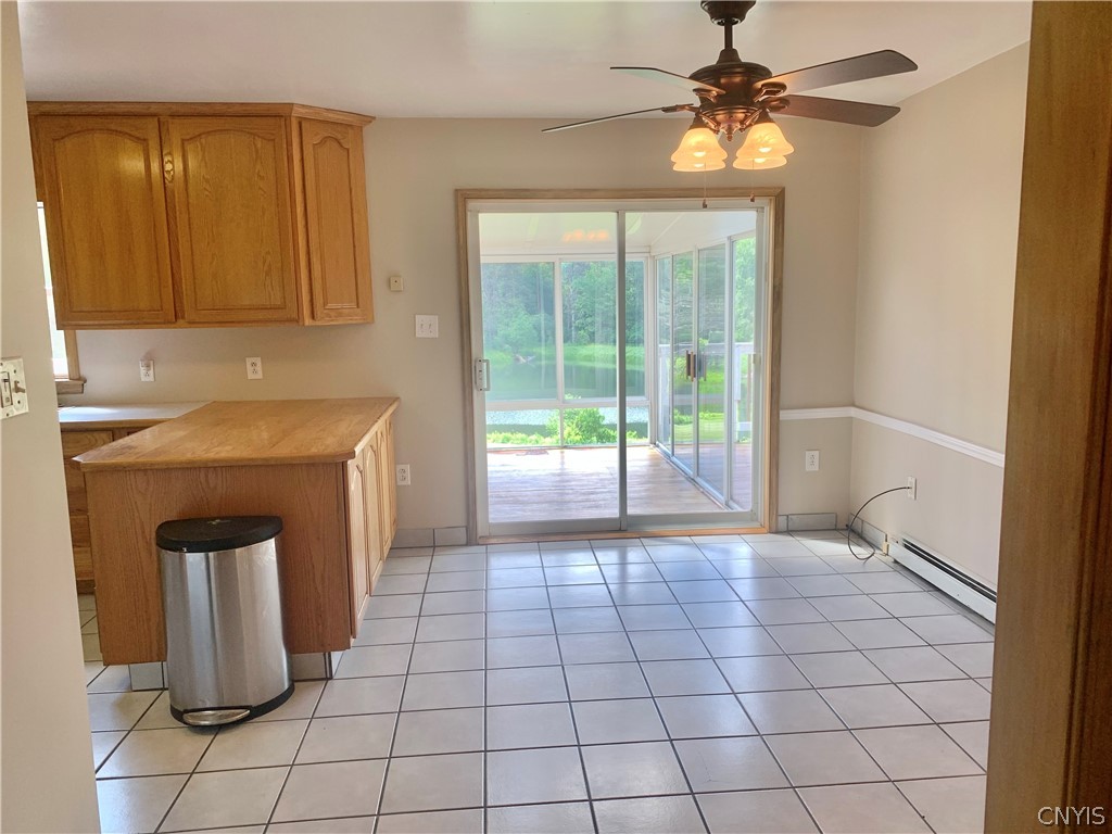 10149 Bailey Lake Road Brookfield, NY 13480 - Photo 26 of 49 Kitchen eat-in area has sliding doors to rear deck