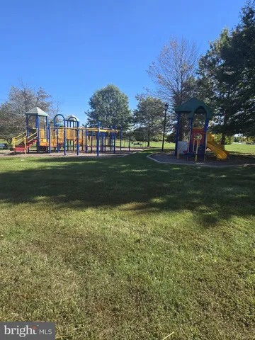 a front view of a residential apartment building with a yard