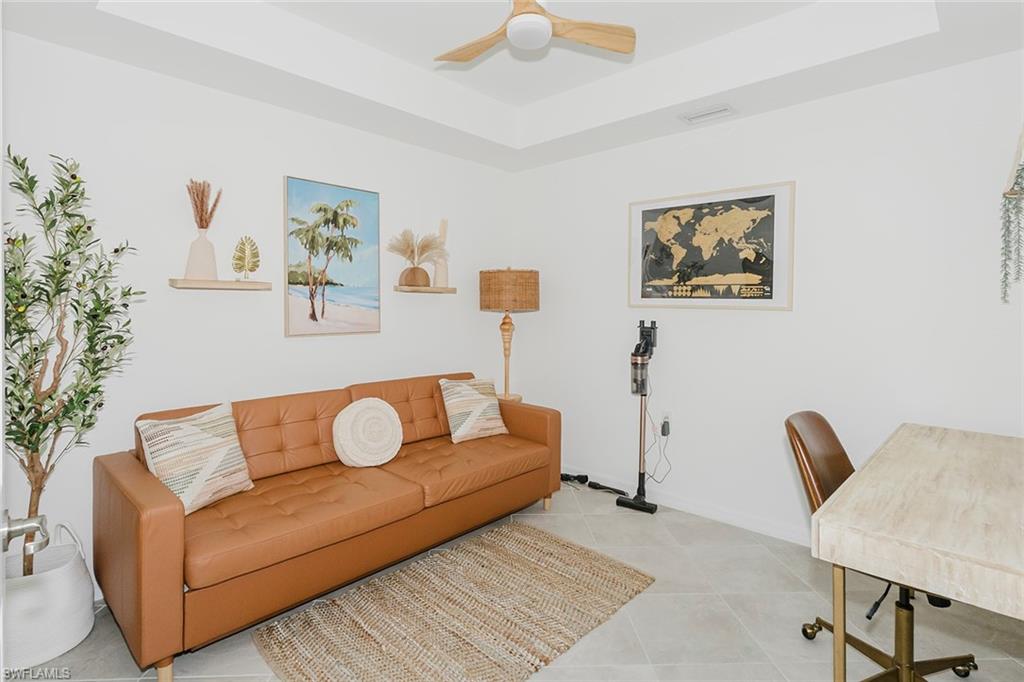 5445 Double Eagle Circle, Unit 3013 Ave Maria, FL 34142 - Photo 14 of 41 a living room with furniture and a potted plant