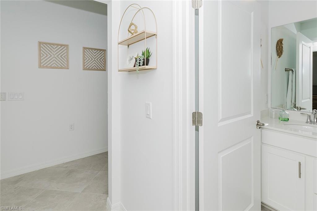 5445 Double Eagle Circle, Unit 3013 Ave Maria, FL 34142 - Photo 17 of 41 a bathroom with a shower and a sink