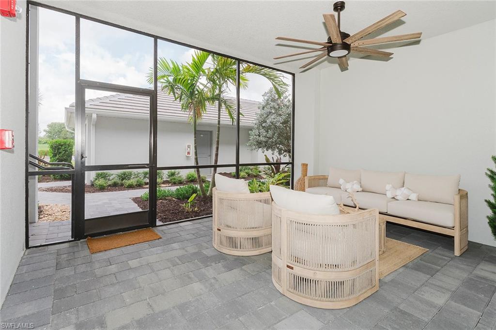 5445 Double Eagle Circle, Unit 3013 Ave Maria, FL 34142 - Photo 23 of 41 a living room with furniture and a window