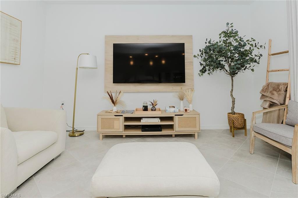 5445 Double Eagle Circle, Unit 3013 Ave Maria, FL 34142 - Photo 8 of 41 a living room with furniture and a couch